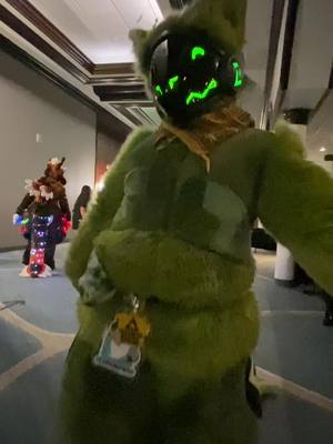 A post by @viridianprotogen on TikTok caption: POLE #furry #fursuit #protogen #stratosfur2022 #stratosfur