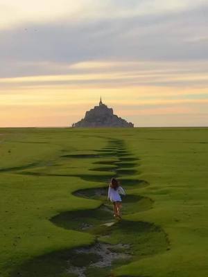 A post by @views.tt on TikTok caption: 📍Mont Saint-Michel, France looks stunning as always.. 😍 #france #travel #fyp #fypシ #views #view #vacation #holiday #castle