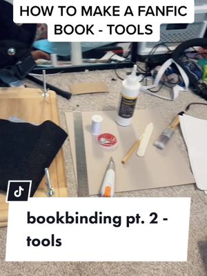 A post by @kidcorvidae on TikTok caption: basic tools for fanfiction bookbinding! do you guys have specific things you'd like a tutorial on how to do? #bookbinding #fanfic #fanfiction #fanbinding