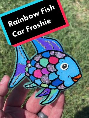 A post by @freshiesbyturtle on TikTok caption: Who remembers reading rainbow fish as a kid? #freshiesinthemaking #freshies #carfreshies #HowTo #rainbowfish #fyp