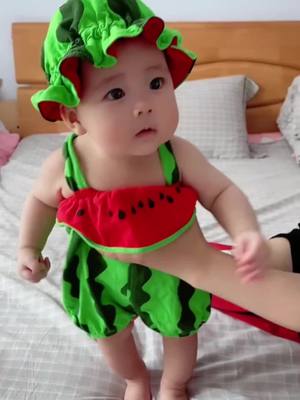 A post by @norahbaby_us on TikTok caption: Small Watermelon🥰🥰#baby #funny #cutebaby #funnybaby