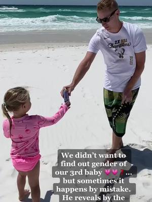 A post by @mretzlaff3 on TikTok caption: Dad reveals to family his secret of the baby’s gender by wearing trunks the color of baby’s sex. #babyannouncement #surprisebabygender #didntwanttoknow