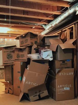 A post by @magicxmeg on TikTok caption: After 5 straight days of #unpacking, time to tackle the mountain of #moving boxes I didnt want to deal with #timelapse #colorado