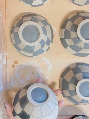 A post by @pinetreepottery on TikTok caption: painted some funky bowls 🪩 #fyp #foryou #pottery #ceramics #handmade #clay #art #artist #boise #boiseidaho #SmallBusiness #throwing #painting #wheel