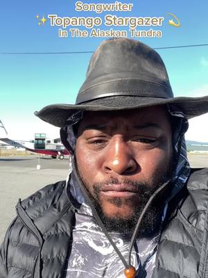 A post by @topangostargazer on TikTok caption: Country Music Artist Topango Stargazer is on expedition in the Alaskan Tundra. There is a rumor he may even play a show or two! Shout out to Wright Air Service #taylorguitars #marmot #countrymusictiktoks #Outdoors #arcticcircle #aviation #alaska