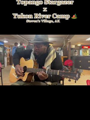 A post by @topangostargazer on TikTok caption: Warming up before an intimate performance at Yukon River Camp, Alaska. Topango’s cover of Luke Combs “Houston We Got A Problem” was a huge hit! Special thanks to the staff and management for your tremendous hospitality and famous delicious pies.#yukonriver #alaska #countrymusictiktoks #ontheroad #emergingartist