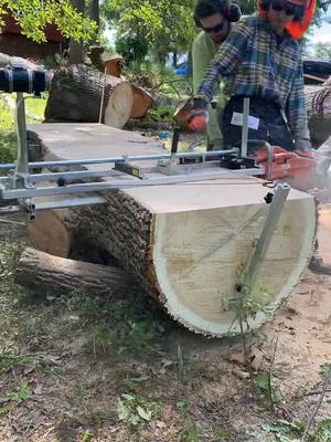 A post by @designedwithpurpose on TikTok caption: I got a chainsaw mill! Too much fun…We had a huge storm near here and lost a lot trees. Couldn’t afford to invest in a bandsaw mill yet, but I’ll use this to cut up unique pieces that seem worth it.  This is an upper section of a black oak,(similar grain to red oak) 114 years old. This is the smaller of the two 14 foot long sections we cut. Total of 6 (two not picture) slabs cut at 2.75” thick. #designedwithpurpose #baltimore #chainsawmill #slabs 