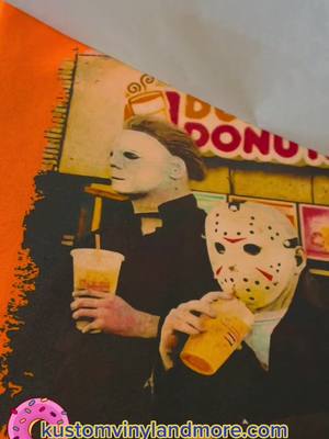 A post by @kustomvinyl on TikTok caption: #dunkindonuts #michaelmyers #jasonvoorhees #shirtshop #dtg #dtgprinting #customshirts #halloweenshirts #halloweenmovie #fridaythe13th #campcrystallake