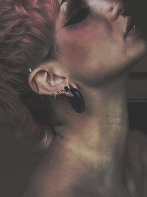 A post by @heyy.killer on TikTok caption: Features #splittongue #bodymods #piercing #piercings #makeup #beauty #theythem #art #features #WorldPrincessWeek