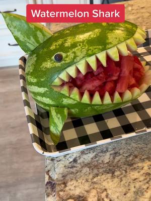 A post by @papa5235 on TikTok caption: Carving a shark out if watermelon. #watermelon #foryoupage #shark