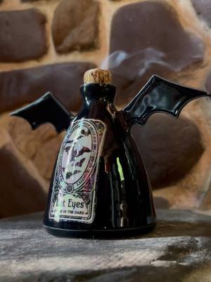 A post by @dirtworks_ceramics on TikTok caption: Spookystock goes live Friday 9/2 at 8pm EST 🦇 #spooky #potion #incense #potionbottle #spookyseason