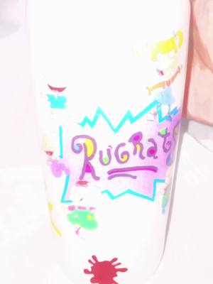 A post by @lnvdesigns on TikTok caption: #rugrats #customtumbler