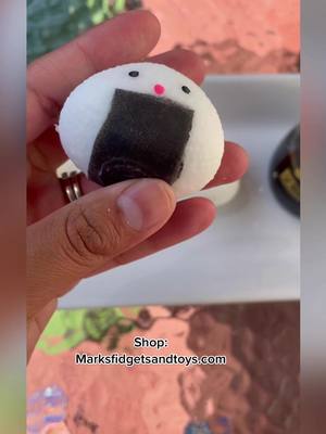 A post by @marksfidgetsandtoys on TikTok caption: Sushie squishies 😍😍 link in bio to shop #sushi #fidgettoys #sale #squishy #oddlysatisfying 