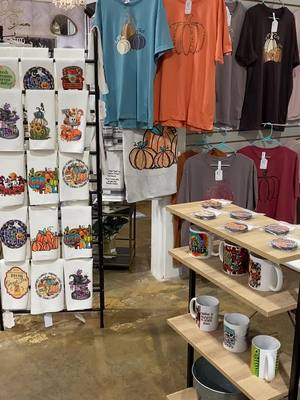 A post by @vinylcreations on TikTok caption: Our products in action at Studio 95 at Painted Tree in Cary, NC. #sublimationideas #carync #campinggifts #gardenflag #boutique #throwblanket #homedecor #paintedtreeboutiques