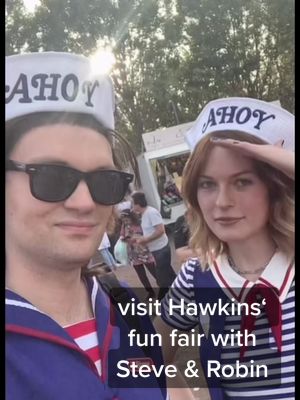 A post by @quialastaris on TikTok caption: visit to Hawkins fun fair // steve is @Andreas Bazylewski // #strangerthings #strangerthingscosplay #steveharrington #robinbuckley #scoopsahoy 