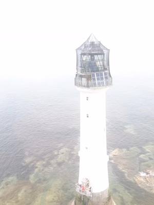 A post by @twentyminutemeals on TikTok caption: #lighthouse #sea #ropeaccesstechnician #towerclimber #haunted 