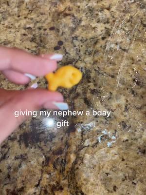 A post by @marisatoz2 on TikTok caption: i’m the best gift giver 😙 #besttiaever #birthday #fyp #nephew #sandiego #goldfish #greenscreen 