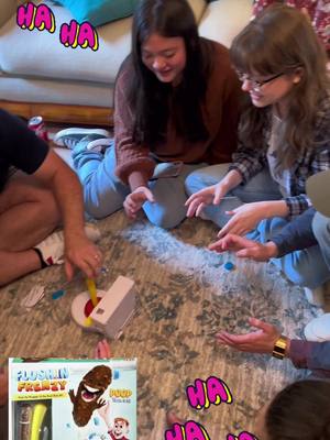 A post by @wendyryoul on TikTok caption: Family Game Night!  Always a good time and with this game - the laughs keep coming!  🤪💩🤪 #familygamenight #GameNight #family #familyfun #flushinfrenzy #wow #wendyonwellness