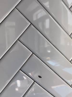 A post by @danvrenos on TikTok caption: Herringbone backsplash #subway #tile #herringbone #backsplash #reno 