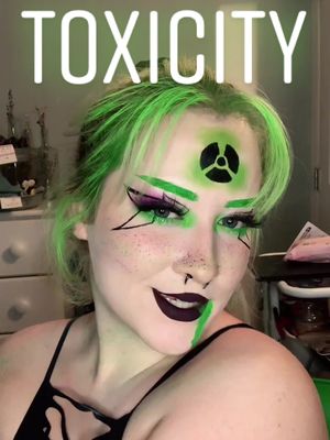 A post by @ebond2338 on TikTok caption: Sooooo I had to do a make up look to this song by @LYLYTH because it's a fire ass song and I wanted to do a semi Halloween look for it 🖤💚