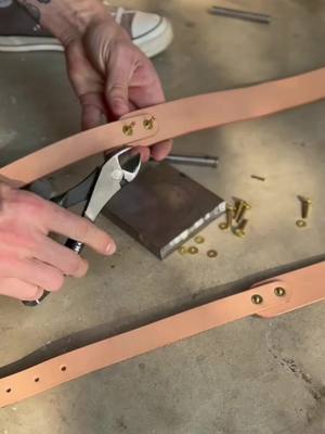 A post by @lowtideleather on TikTok caption: Setting brass rivets by hand ⚡️ #leathercraft #handmadegoods #leatherworking #makingvideo #processvideo #asmrcraft #asmrsounds #handmadecraft #rivetsetting #copperrivet #brass