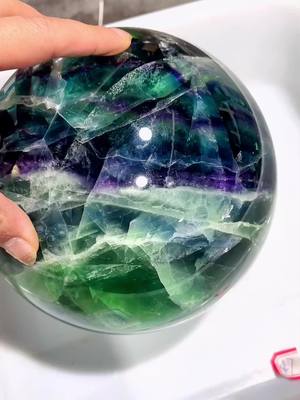 A post by @ng_crystal_factory on TikTok caption: Please follow my new channel @ngcrystalpage1 we have live show every day#fluorite sphere#natural #crystal caving