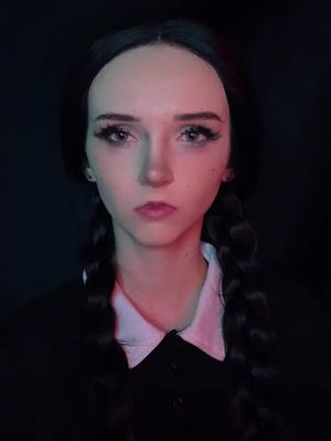 A post by @wickedwaifu on TikTok caption: Sorry for staring into your soul there lol #wednesdayaddams #addamsfamily #halloween #wednesdayaddamscosplay 