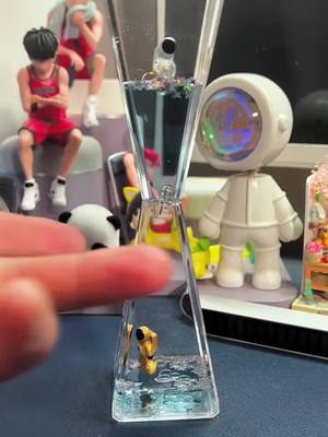 A post by @engpow on TikTok caption: #toy #Astronauts #hourglass