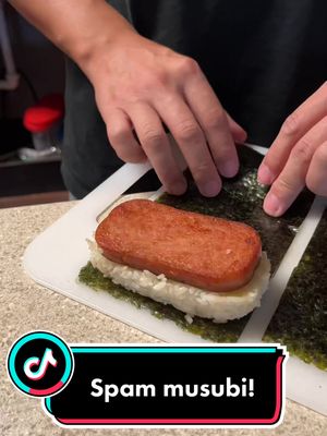 A post by @aimyyz on TikTok caption: It was our first time making #spammusubi!! 😆 