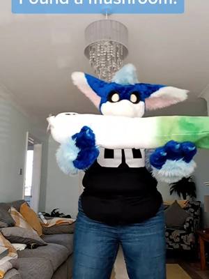 A post by @bluefloofuk on TikTok caption: Rule 1 of Alfie, don't make him mad. Disaster is sure to follow.....  Side note this was really fun and let me practice holding my Farfetch'd leek with my paws. Hope you enjoyed this tiny lore nugget. #fursuit #dragon #dutchangeldragon #furry #fyp #pokemon #labtest #lore #mushroom #floof #fursuitfriday 