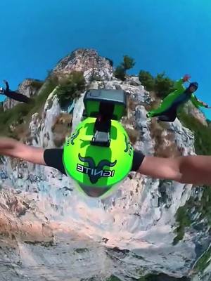 A post by @extremesports2077 on TikTok caption: #extremesports #amazing #freedom #GenshinImpact32 #insane #batman #sky #floating #falling 