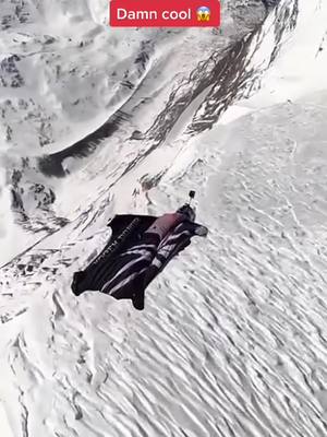 A post by @extremesports2077 on TikTok caption: #extremesports #amazing #freedom #insane #batman #falling #fly #wingsuit #snow 