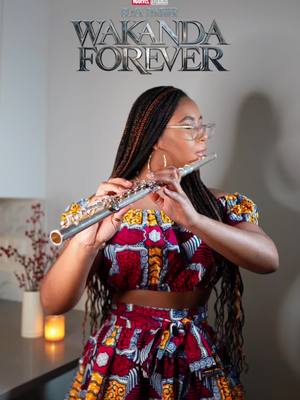 A post by @iamsanamalynda on TikTok caption: Y’all got your tix to see Black Panther: Wakanda Forever? 🎫🎶✊🏾 #wakandaforevermovie #blackpantherwakandaforever #blackpanthermusic #liftmeupchallenge #nowomannocry❤️ #flutemix #blackmusiciansbelike 