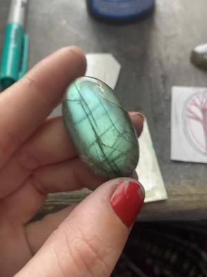 A post by @thlaylidesigns on TikTok caption: A twisted tree and an aurora sky #silversmith #metalsmithing #jewelry #cottagecore #artistsoftiktok #forestgirl #witch #forest #nightsky #labradorite #auroraborealis 