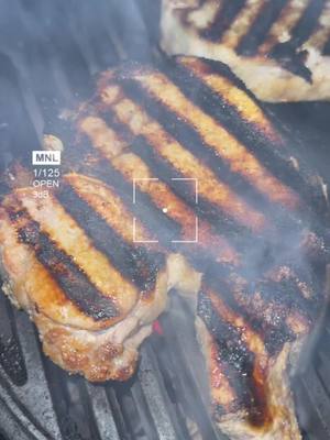 A post by @indyfoodguy on TikTok caption: Pork Chops grilled on Kamado Joe Jr #kamadojoe #grilledporkchops #grill #homecook #koreanfood #sogood #goodfood #grillmarks 