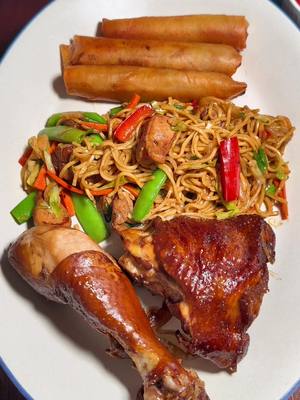 A post by @indyfoodguy on TikTok caption: Chicken Adobo, Pancit Bihon, and Lumpia Shanghai #phillipines #phillipinofood #filipinofood #goodfood #homecook #chicken #chickenadobo #pancitbihon #lumpiashanghai #indianapolis 