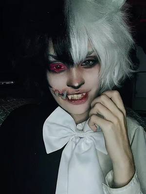 A post by @mariloucosplay on TikTok caption: #danganronpa #danganronpacosplay #monokuma #monokumacosplay #foryou #fyp 