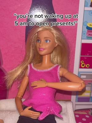 A post by @madelynsfamily on TikTok caption: merry christmas everyone! sorry we haven’t been posting 🎄 | #barbie #christmas #pregnant #surprise #fypシ #blowup #foryou