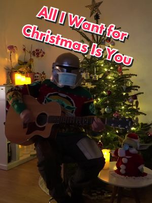 A post by @themaskalorian on TikTok caption: Merry Christmas! #mariahcarey #alliwantforchristmas #cover  #babyyoda #fyp 