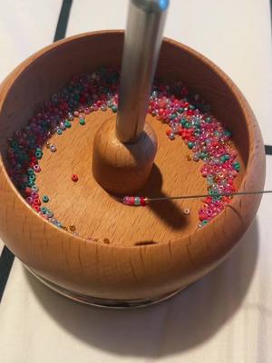 A post by @junes.jewels on TikTok caption: Replying to @preppy.vlogz.65 how to use a bead spinner! #claybead #claybeads #Claybeadbracelets #junesjewels #beadedjewelry #preppy #beads #claybeads #seedbeads #bracelets #necklace #preppybracelets #fyp #foryou #foryoupage #fypage #trend #trendy #viral #bracelet #luvya #business #shopsmall #Sm#SmallBusinessracelet #rings #trend #tut #tutorial #reply #beadspinner #seedbeads #howto #VoiceEffects 