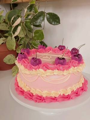 A post by @aframe.on.fletcher on TikTok caption: ☹️ sad pistachio cardamom cake with raspberry lavender filling for my friend going through a break up ☹️ don’t judge my cake decorating skills i tried my best 🥲🍒