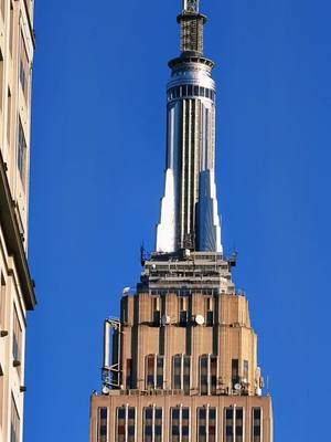 A post by @aspassopernewyorkcity on TikTok caption: @empirestatebldg up close ♥️ #empirestatebuilding #empirestate #newyork #nyc #superzoom #zoom #tourguide #guide #manhattan