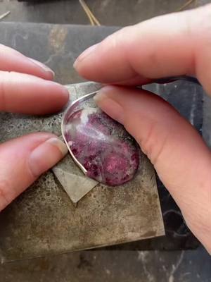 A post by @thlaylidesigns on TikTok caption: Pretty pink and hidden pomegranates #silversmith #metalsmithing #jewelry #cottagecore #artistsoftiktok #witch #slowcrafts #pomegranate 