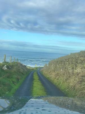 A post by @landscape.uu on TikTok caption: Would you drive down here?😳  #ireland #placestogo #roadtrips #irishwinter#irishsea #wildathlanticway#discoverireland#fypシ #foryou #forbestravelguide 