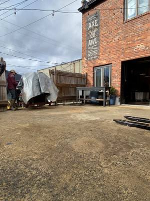 A post by @axeandawlleatherworks on TikTok caption: So glad to have the hydraulic clicker moved to our shop! 3000 lbs, and lots of obstacles to overcome. #clickerpress #leather #workshop #leathercraft