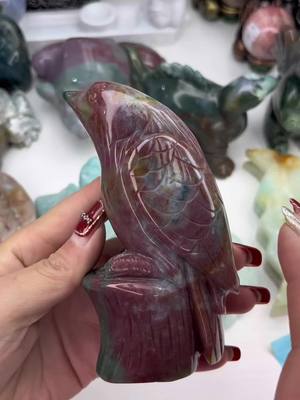 A post by @dh_crystal_magic on TikTok caption: Ocean jasper carvings #dhcrystalservice #carving 