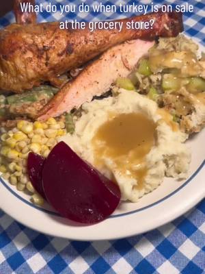 A post by @indyfoodguy on TikTok caption: What do you do when turkey is on sale at the grocery store? Smoke a turkey and have a feast! #turkey #smokedturkey #feast #goodfood #homecooking #pumpkinpie #food #Foodie #menu  smoked turkey, mashed potatoes, gravy, corn, cranberry jelly, stuffing, green bean casserole, and pumpkin pie 