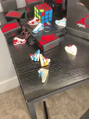 A post by @sandsandpainting on TikTok caption: 🎊Click my homepage link and buy gifts to your love!#gift #birthday #yeechop #present #giftforhim #DIY #fyp #fypシ #3d #sneakers #minishoes #airjordan #dunk #sneaker #miniature #yeezy #keychain 