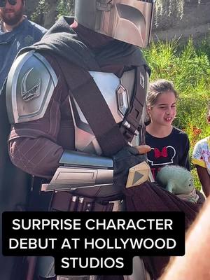 A post by @gavin_miless on TikTok caption: The Mandalorian makes his debut appearance at Hollywood Studios in Walt Disney World🤩 #wdw #waltdisneyworld #galaxiesedge #starwars #mandolorian #grogu #hollywoodstudios 