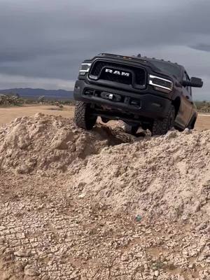 A post by @nickhamilton15 on TikTok caption: Time for 37s #usa #arizona  #2a #ram  #powerwagon  @carvenexhaust @fcklightbars @mickeythompsontires 